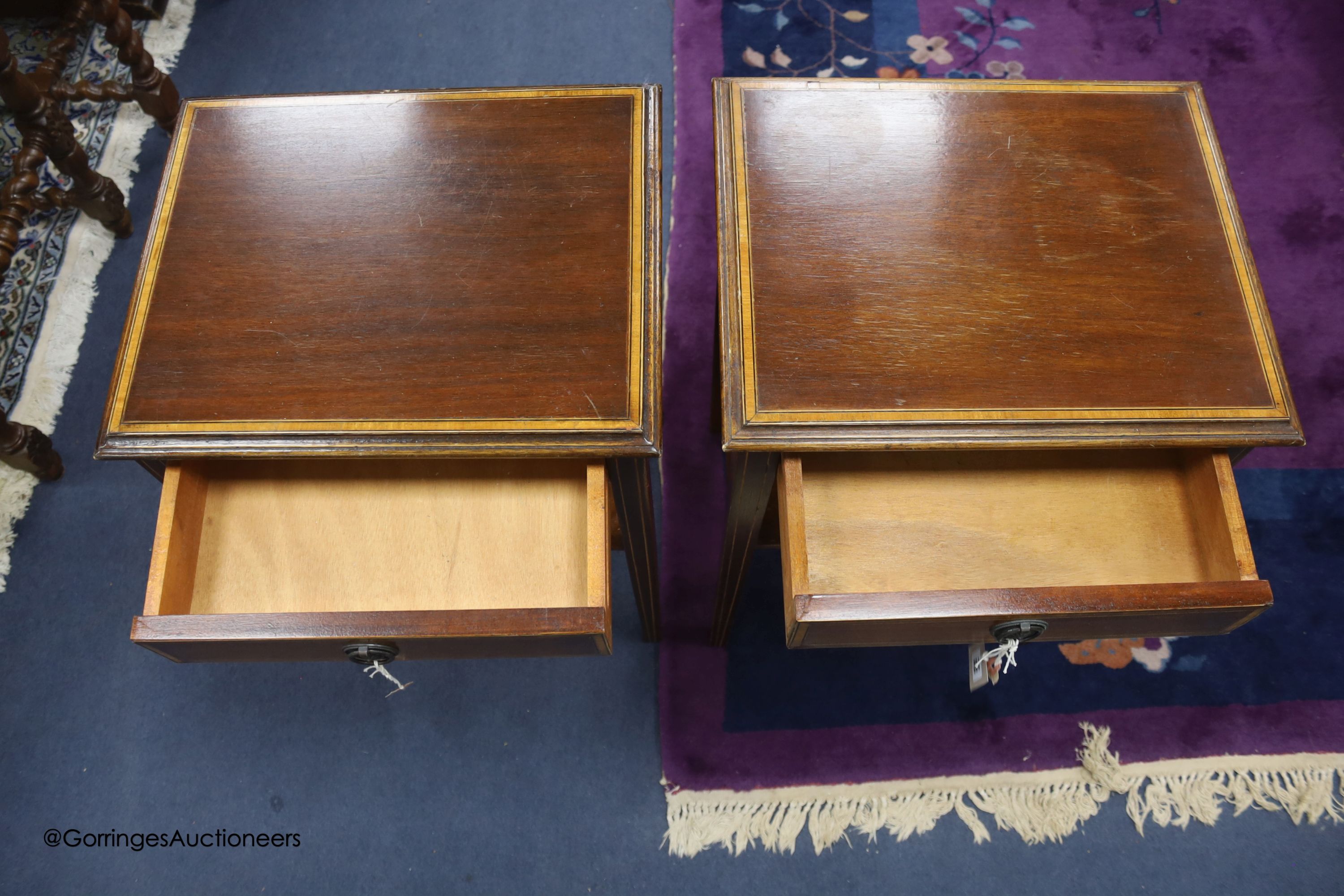 A pair of satinwood banded mahogany two tier tables, from Officer's Mess RAF Biggin Hill, sold by the Ministry of Defence, Feb 1994, width 41cm depth 33cm height 61cm